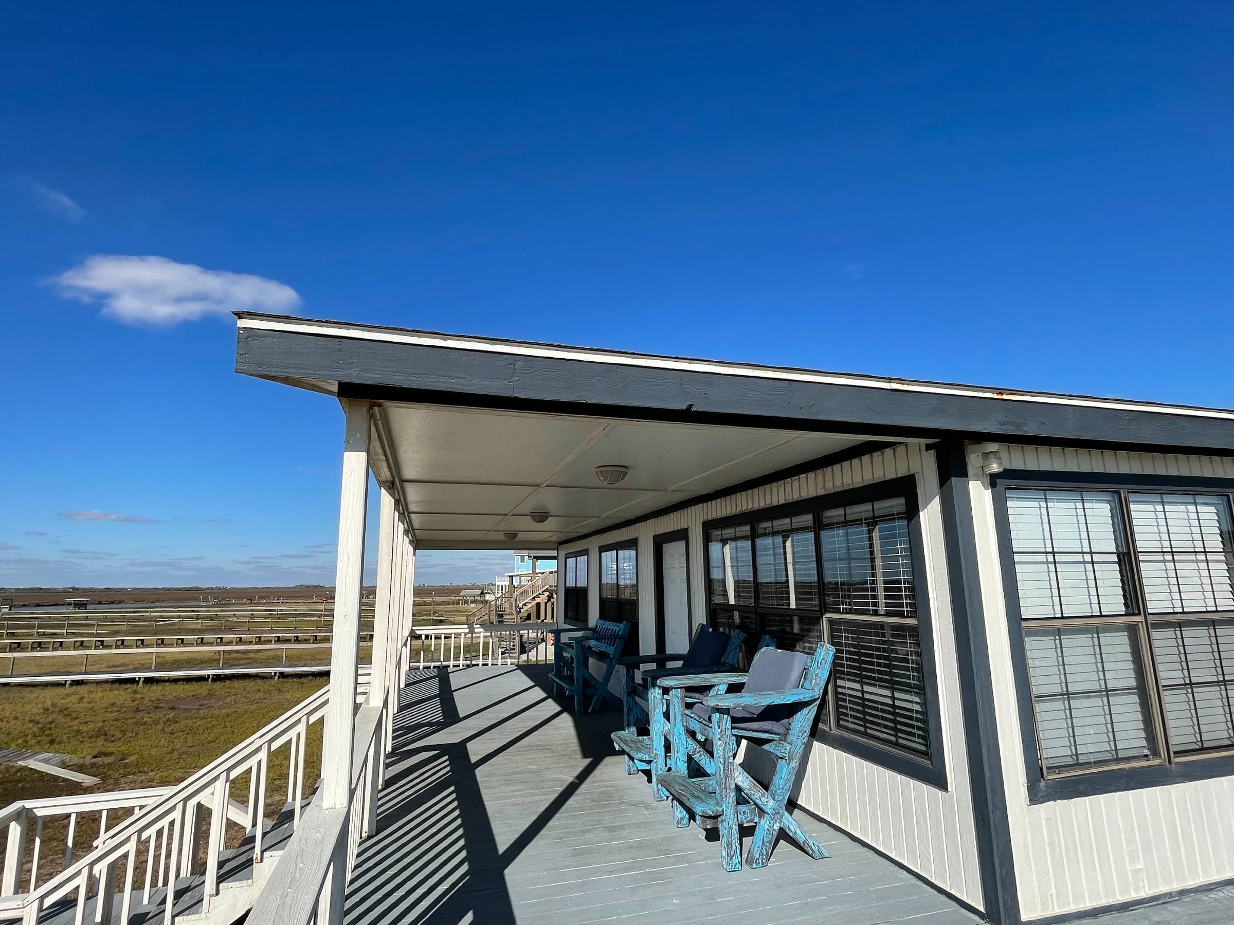 Covered deck from which to enjoy beautiful evening sunsets and abundant wildlife.